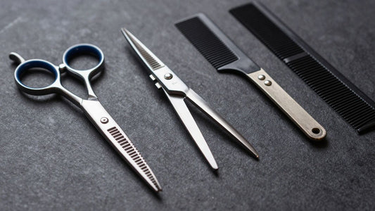 Professional barber tools including scissors, clippers, and combs.